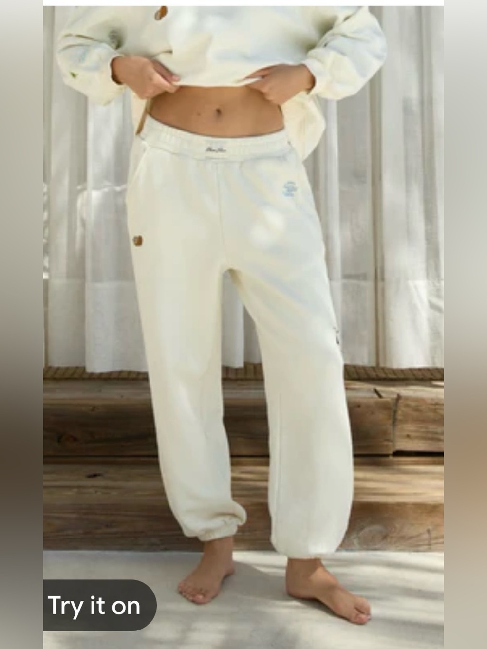 Eleven Eleven Coconut cream Graphic Jogger Pants with embroidery; Size Small.